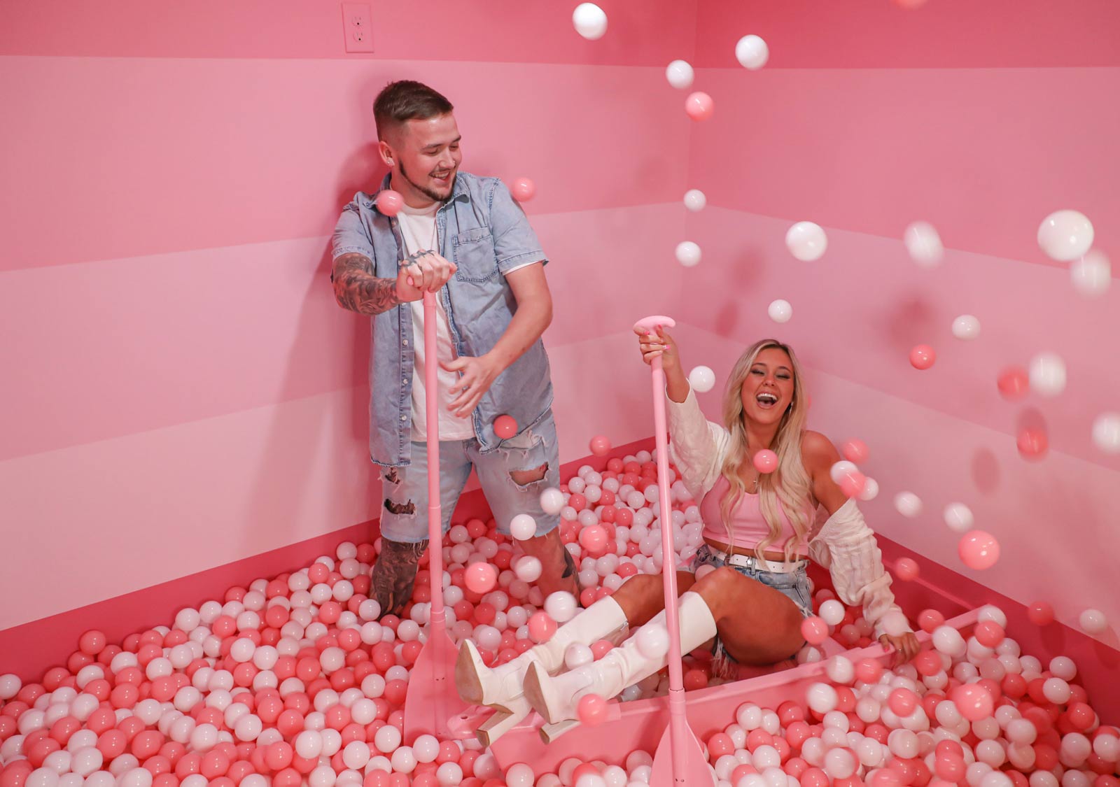 people in pink ball pit